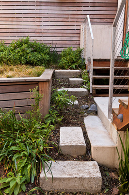 Modern rectilinear stair risers of poured concrete.