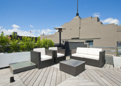 Evergreen wax myrtle makes an attractive screen on this clean, modern roof deck in the South Beach neighborhood of San Francisco..