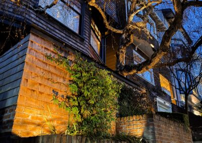 Pacific Heights Jewel: Creative brickwork fronting a 100-year-old house with custom bike shed and family heritage tree as focal point.