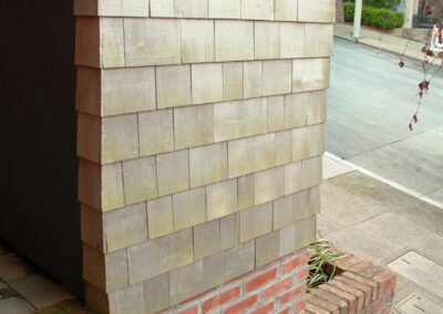 Pacific Heights Jewel: Creative brickwork fronting a 100-year-old house with custom bike shed and family heritage tree as focal point.