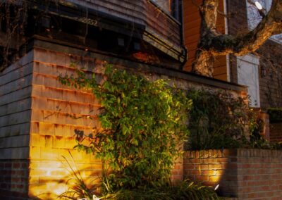 Pacific Heights Jewel: Creative brickwork fronting a 100-year-old house with custom bike shed and family heritage tree as focal point.