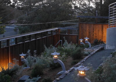 Pacific Rim Fusion: On a steep site under sandy conditions we melded Japanese aesthetics with landscape lighting and California native plants.
