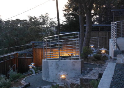 Pacific Rim Fusion: On a steep site under sandy conditions we melded Japanese aesthetics with landscape lighting and California native plants.