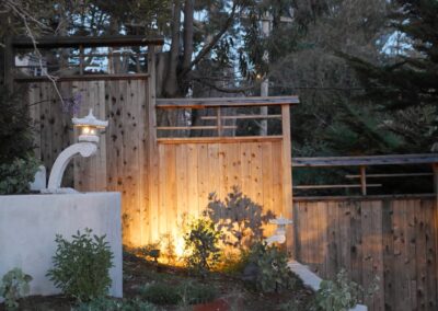 Pacific Rim Fusion: On a steep site under sandy conditions we melded Japanese aesthetics with landscape lighting and California native plants.
