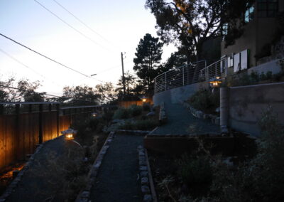 Pacific Rim Fusion: On a steep site under sandy conditions we melded Japanese aesthetics with landscape lighting and California native plants.