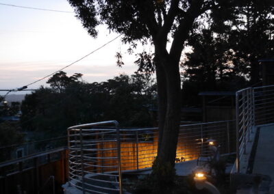 Pacific Rim Fusion: On a steep site under sandy conditions we melded Japanese aesthetics with landscape lighting and California native plants.