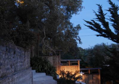 Pacific Rim Fusion: On a steep site under sandy conditions we melded Japanese aesthetics with landscape lighting and California native plants.