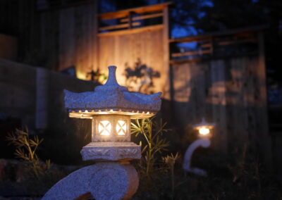 Pacific Rim Fusion: On a steep site under sandy conditions we melded Japanese aesthetics with landscape lighting and California native plants.