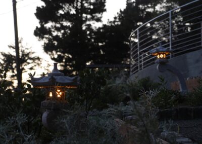 Pacific Rim Fusion: On a steep site under sandy conditions we melded Japanese aesthetics with landscape lighting and California native plants.