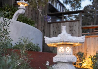 Pacific Rim Fusion: On a steep site under sandy conditions we melded Japanese aesthetics with landscape lighting and California native plants.