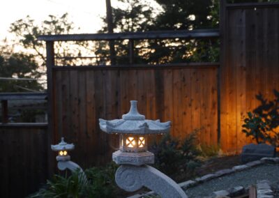 Pacific Rim Fusion: On a steep site under sandy conditions we melded Japanese aesthetics with landscape lighting and California native plants.
