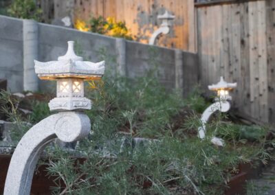 Pacific Rim Fusion: On a steep site under sandy conditions we melded Japanese aesthetics with landscape lighting and California native plants.